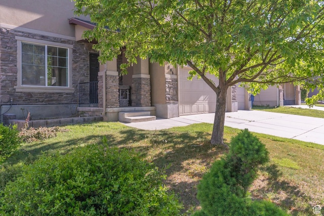 886 Cambridge Dr, North Salt Lake, UT 84054 - view of front of house with concrete driveway, stone siding, stucco siding, and a front lawn