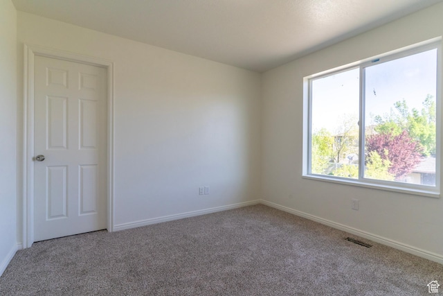 886 Cambridge Dr, North Salt Lake, UT 84054 - unfurnished room featuring carpet, healthy amount of natural light, and baseboards
