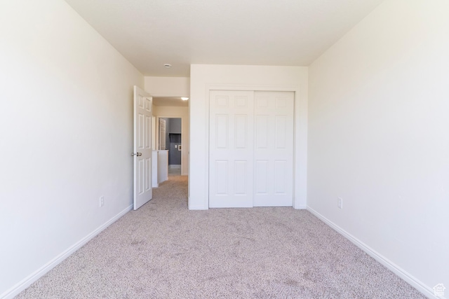 886 Cambridge Dr, North Salt Lake, UT 84054 - unfurnished bedroom with carpet flooring, baseboards, and a closet