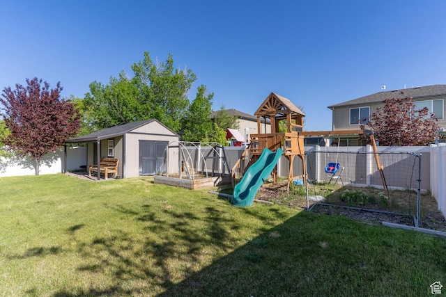 886 Cambridge Dr, North Salt Lake, UT 84054 - view of playground with a shed, an outbuilding, and a garden