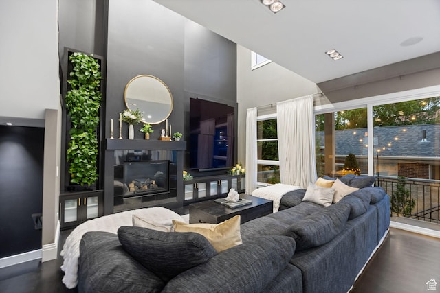 54 N B St, Salt Lake City, UT 84103 - living room with a towering ceiling, baseboards, a fireplace, and wood finished floors