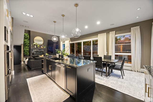 54 N B St, Salt Lake City, UT 84103 - kitchen with stainless steel dishwasher, open floor plan, dark wood-style floors, a sink, and a center island with sink