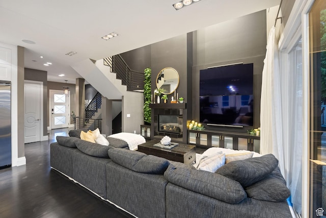 54 N B St, Salt Lake City, UT 84103 - living room with stairway, a glass covered fireplace, wood finished floors, and recessed lighting