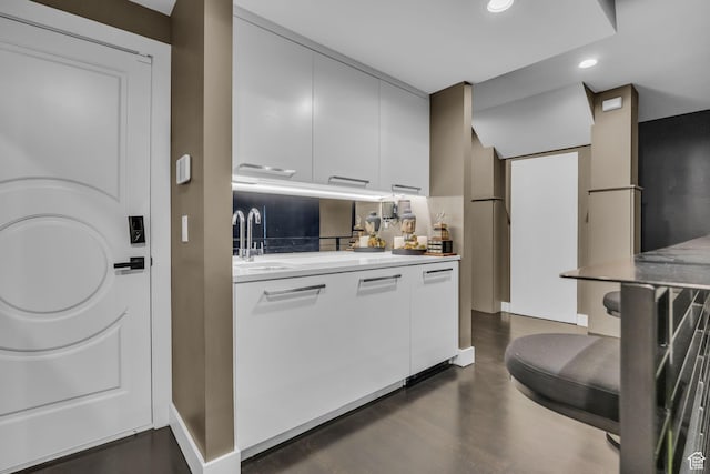 54 N B St, Salt Lake City, UT 84103 - kitchen featuring a sink, recessed lighting, light countertops, and white cabinets
