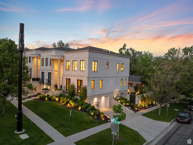 54 N B St, Salt Lake City, UT 84103 - modern home with driveway, a garage, a front lawn, and stucco siding