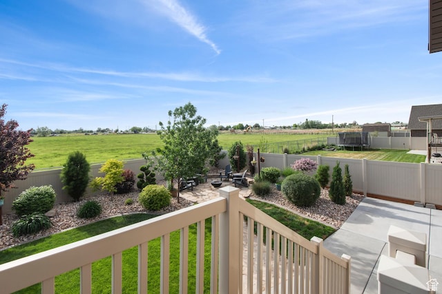 view of yard with a rural view