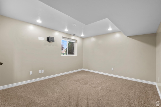 below grade area featuring carpet, baseboards, and recessed lighting