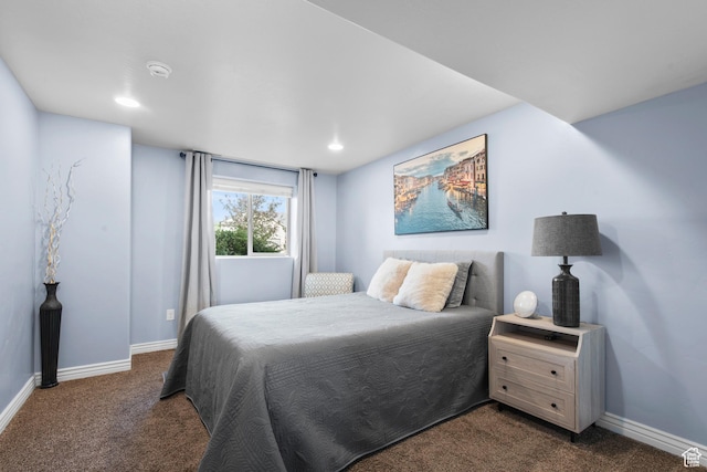 bedroom featuring dark carpet, baseboards, and recessed lighting