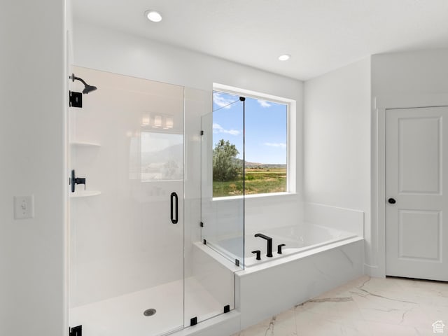 1427 N 290 E Unit 02, Salem, UT 84653 - bathroom with marble look tiles, a bath, a shower stall, and recessed lighting