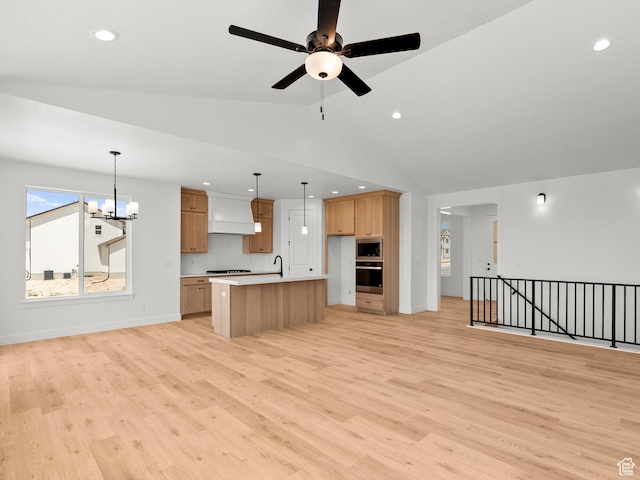 1427 N 290 E Unit 02, Salem, UT 84653 - kitchen with open floor plan, appliances with stainless steel finishes, a chandelier, light wood-style floors, and lofted ceiling