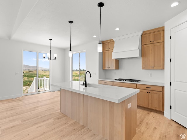 1427 N 290 E Unit 02, Salem, UT 84653 - kitchen with premium range hood, gas stovetop, light countertops, light wood-style floors, and recessed lighting