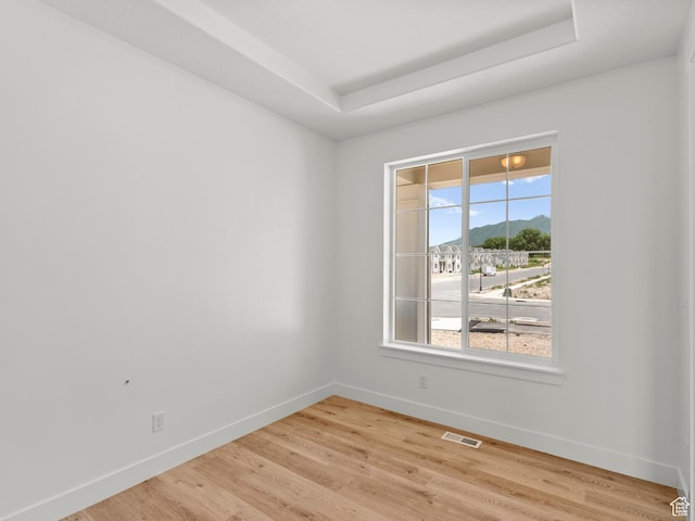 1427 N 290 E Unit 02, Salem, UT 84653 - unfurnished room with a tray ceiling, light wood finished floors, and a mountain view