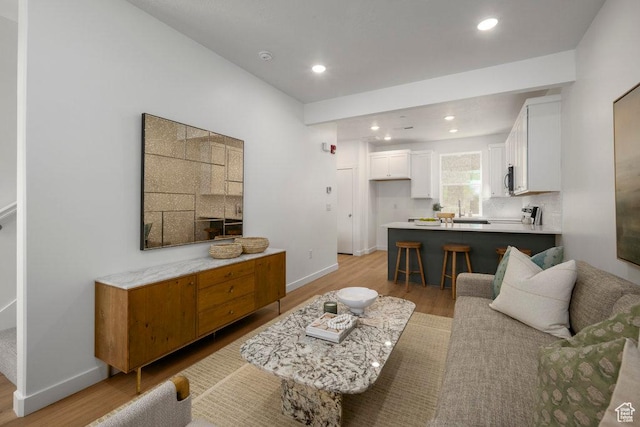 309 W Azure Sky Ln Unit 5-26, Salt Lake City, UT 84103 - living area with light wood-style floors, baseboards, and recessed lighting
