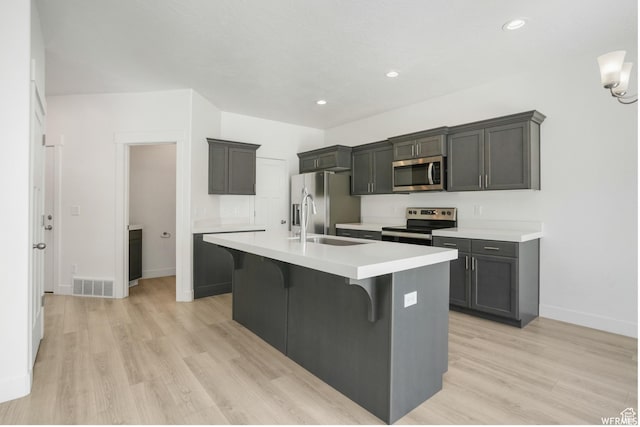 172 S 880 E, American Fork, UT 84003 - kitchen featuring appliances with stainless steel finishes, light wood-style flooring, a sink, baseboards, and recessed lighting