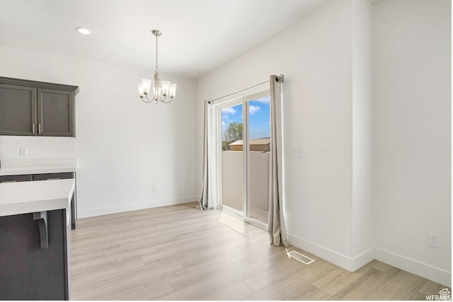 172 S 880 E, American Fork, UT 84003 - unfurnished dining area with a chandelier, light wood-style floors, baseboards, and recessed lighting
