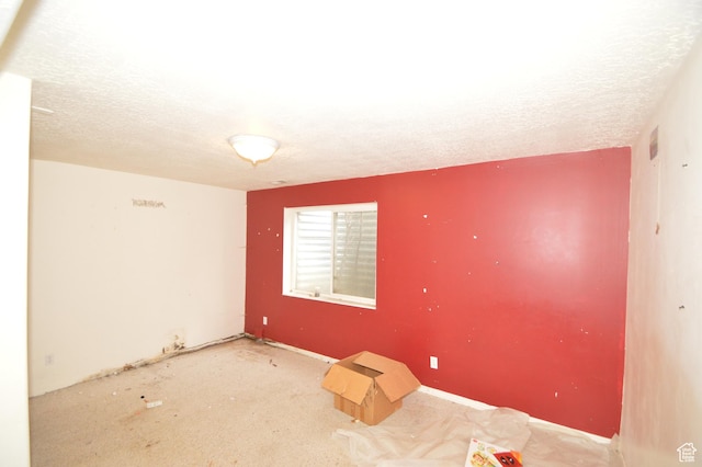 empty room with a textured ceiling
