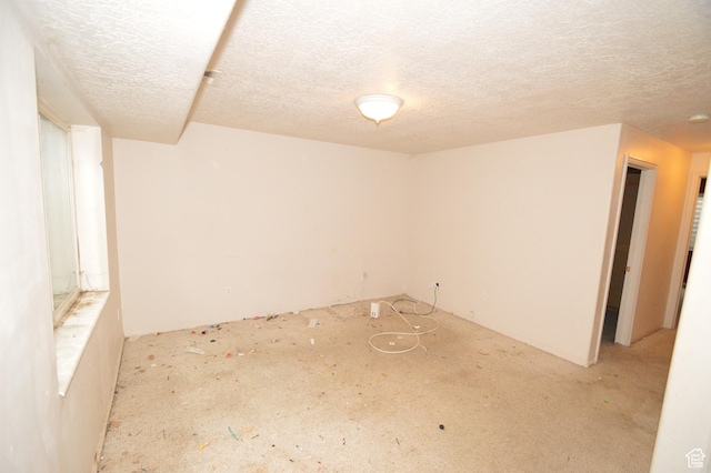 empty room with a textured ceiling