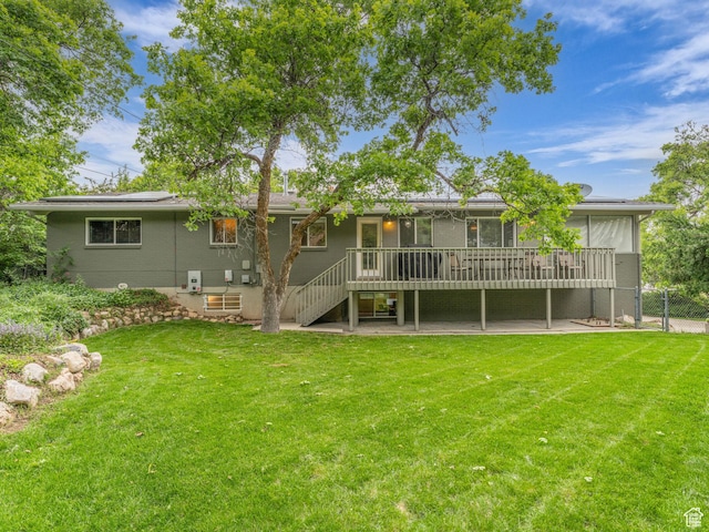 4131 S Fortuna Way E, Salt Lake City, UT 84124 - back of property featuring stairway, a wooden deck, solar panels, and a patio area