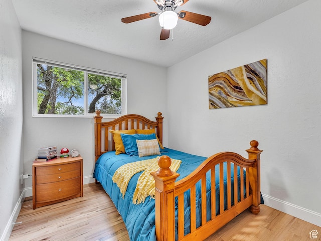 4131 S Fortuna Way E, Salt Lake City, UT 84124 - bedroom with wood finished floors, baseboards, and ceiling fan