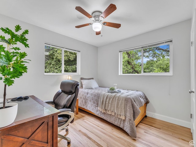 4131 S Fortuna Way E, Salt Lake City, UT 84124 - bedroom with baseboards, light wood finished floors, an office area, and ceiling fan