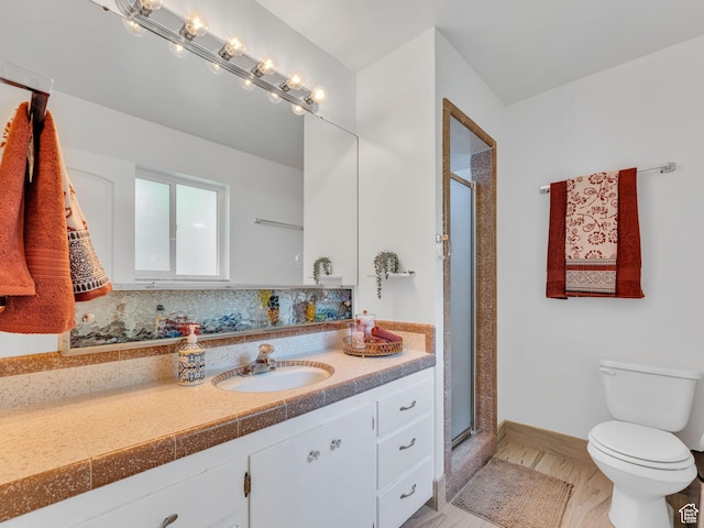 4131 S Fortuna Way E, Salt Lake City, UT 84124 - bathroom featuring toilet, a shower stall, vanity, and baseboards