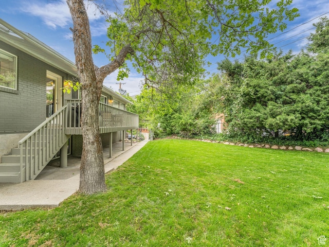 4131 S Fortuna Way E, Salt Lake City, UT 84124 - view of grassy yard featuring a patio area, a wooden deck, and stairs