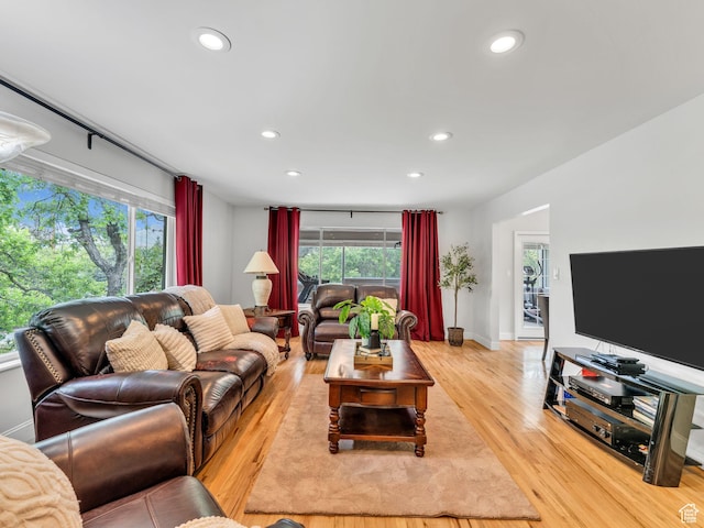 4131 S Fortuna Way E, Salt Lake City, UT 84124 - living room with recessed lighting, light wood-style floors, and baseboards