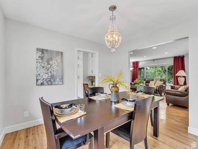 4131 S Fortuna Way E, Salt Lake City, UT 84124 - dining room with a chandelier, light wood finished floors, baseboards, and recessed lighting
