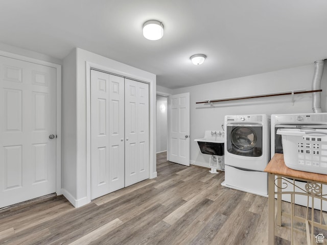 4131 S Fortuna Way E, Salt Lake City, UT 84124 - laundry room featuring washer and dryer, wood finished floors, and baseboards