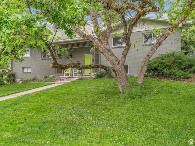 4131 S Fortuna Way E, Salt Lake City, UT 84124 - view of front of home featuring brick siding and a front yard