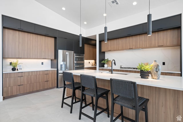 1575 W 840 S, Hurricane, UT 84737 - kitchen with stainless steel fridge, modern cabinets, a sink, a breakfast bar area, and light countertops