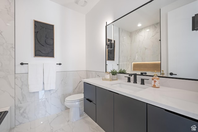 1575 W 840 S, Hurricane, UT 84737 - full bath with tile walls, marble finish floors, toilet, vanity, and wainscoting