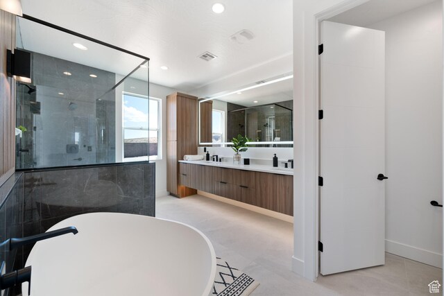 1575 W 840 S, Hurricane, UT 84737 - bathroom featuring a shower stall, recessed lighting, a freestanding bath, double vanity, and baseboards
