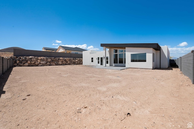 1575 W 840 S, Hurricane, UT 84737 - rear view of property with a fenced backyard and stucco siding