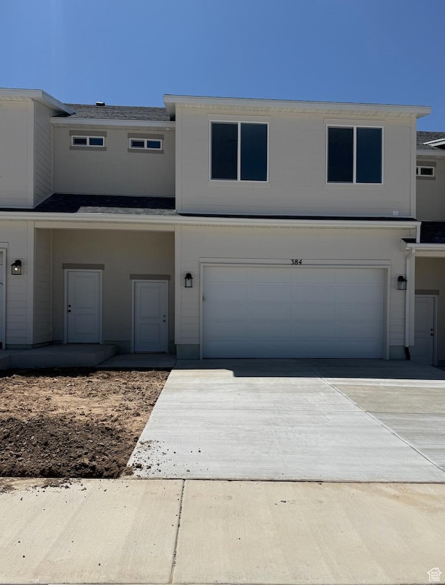 384 E 1480 N Unit 56, Salem, UT 84653 - view of front of house with a garage, driveway, and a shingled roof