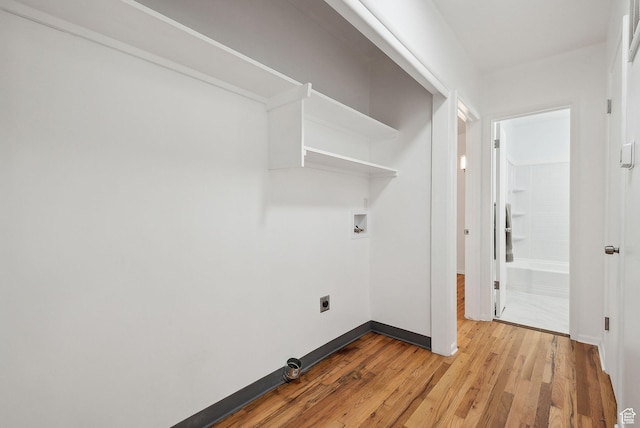 laundry area featuring light wood-style flooring, electric dryer hookup, baseboards, and washer hookup