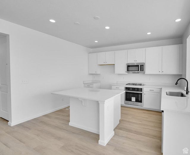 251 W 825 S Unit 306, Willard, UT 84340 - kitchen featuring stainless steel appliances, a sink, a center island, recessed lighting, and light countertops