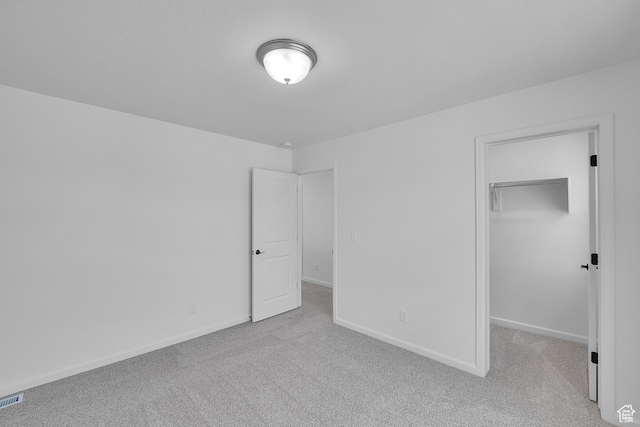 251 W 825 S Unit 306, Willard, UT 84340 - unfurnished bedroom featuring carpet, a walk in closet, and baseboards