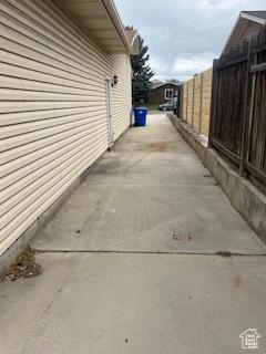 view of home's exterior with fence