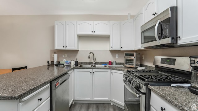 217 E 2300 N, North Ogden, UT 84414 - kitchen featuring appliances with stainless steel finishes, a sink, and white cabinetry