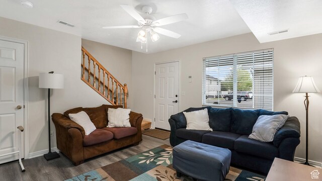 217 E 2300 N, North Ogden, UT 84414 - living room featuring wood finished floors, stairs, ceiling fan, and baseboards