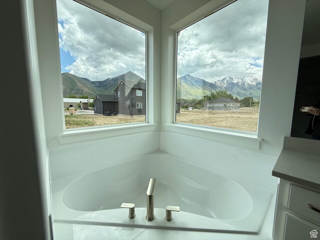 1004 E 360 N Unit 28, Salem, UT 84653 - full bathroom featuring a mountain view, a bath, and vanity