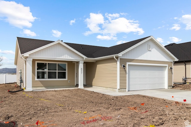 837 N 980 W Unit 66, Tremonton, UT 84337 - single story home featuring driveway, an attached garage, a porch, fence, and a shingled roof