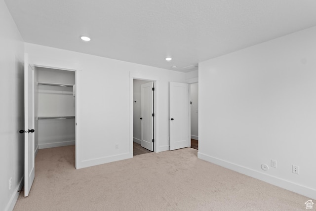 837 N 980 W Unit 66, Tremonton, UT 84337 - unfurnished bedroom featuring carpet, a walk in closet, baseboards, recessed lighting, and a closet