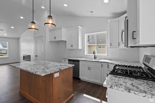 837 N 980 W Unit 66, Tremonton, UT 84337 - kitchen with a sink, appliances with stainless steel finishes, white cabinets, lofted ceiling, and recessed lighting