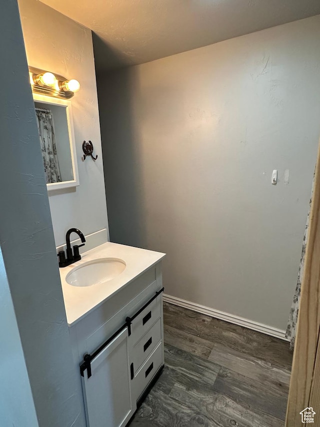 733 Clay St, Montpelier, ID 83254 - bathroom featuring vanity and wood finished floors