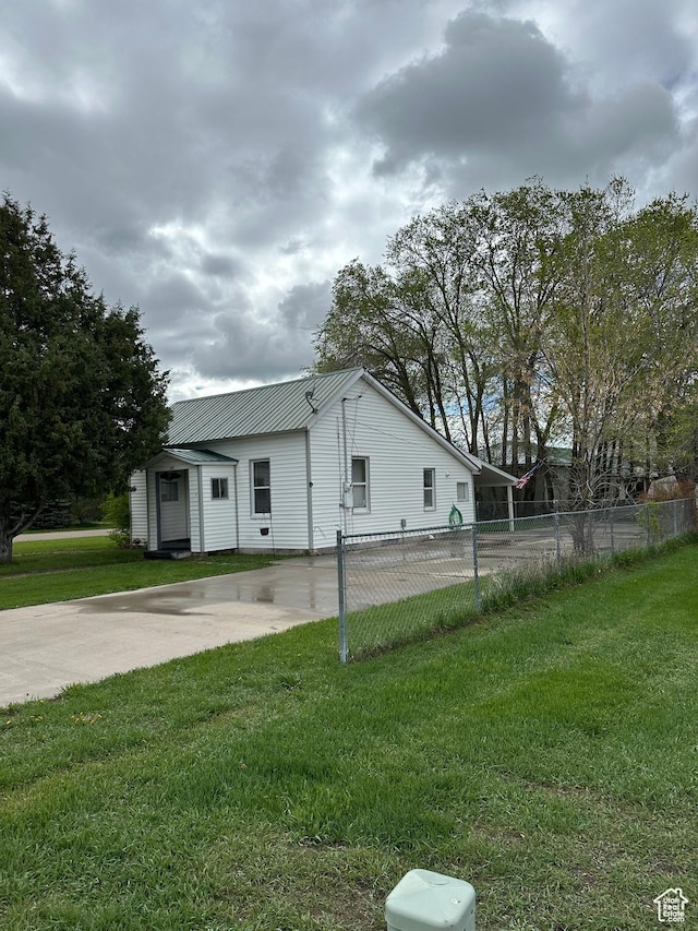 733 Clay St, Montpelier, ID 83254 - view of side of property featuring metal roof and driveway