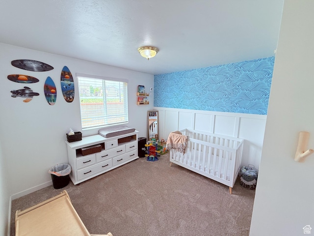 5582 W Joshua Cir S, West Jordan, UT 84081 - carpeted bedroom featuring wallpapered walls, a crib, and wainscoting