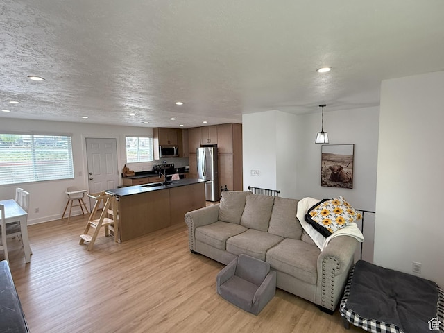 5582 W Joshua Cir S, West Jordan, UT 84081 - living area with light wood-style floors, recessed lighting, and baseboards