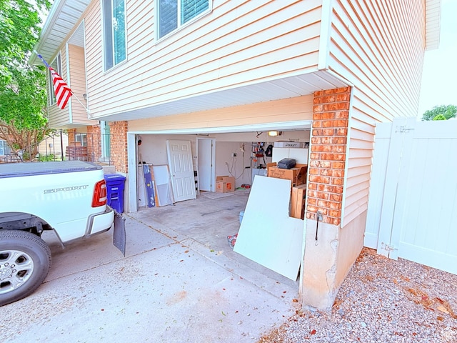 5582 W Joshua Cir S, West Jordan, UT 84081 - garage featuring fence and concrete driveway
